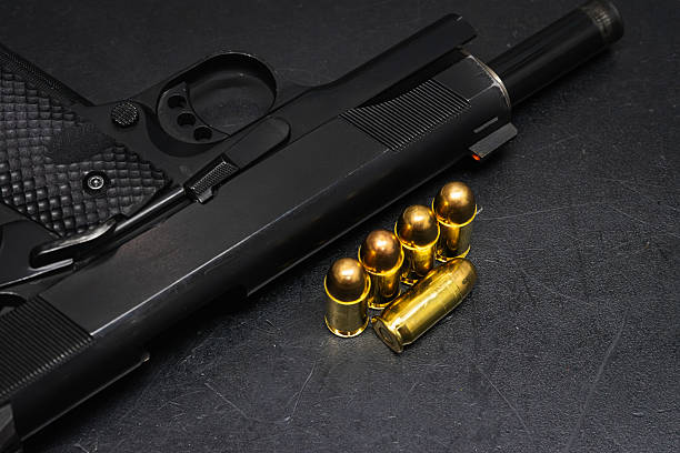45 caliber pistol and cartridges. Self-defense weapon.