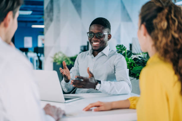 istock Group of business persons talking in the office. 2206170928