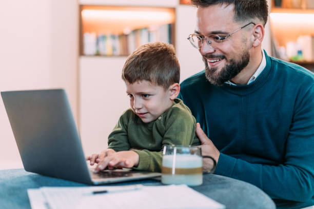 istock Father trying to work from home. 2206172789