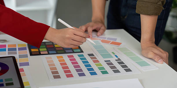 istock Hands-on Design and Collaboration. A designer collaborates with a colleague on color development for a project. 2206180523