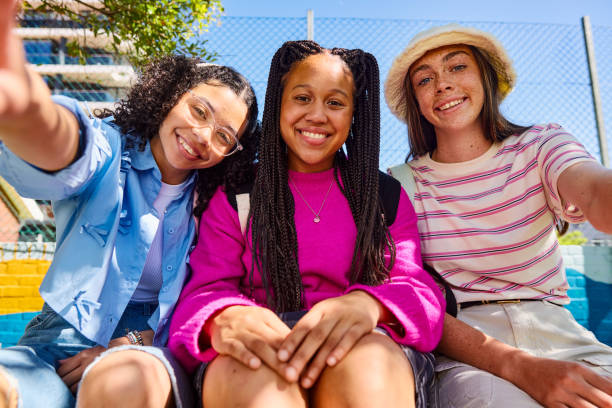 istock Three teenager students taking a selfie outdoors 2206183854