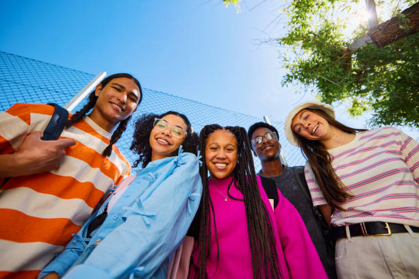 istock Group of diverse high school students smiling at camera 2206183862