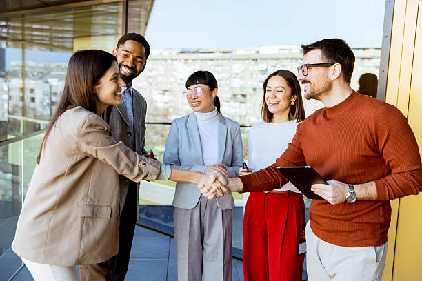 istock Engaging business meeting with diverse professionals exchanging ideas in a modern office setting 2206185996