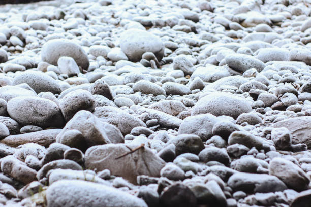 Frozen river in winter with snow and ice on the rocks, Georgia