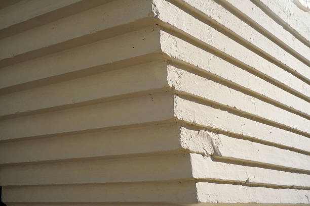 istock Staggered stucco mold in white facade corner detail 2206188766