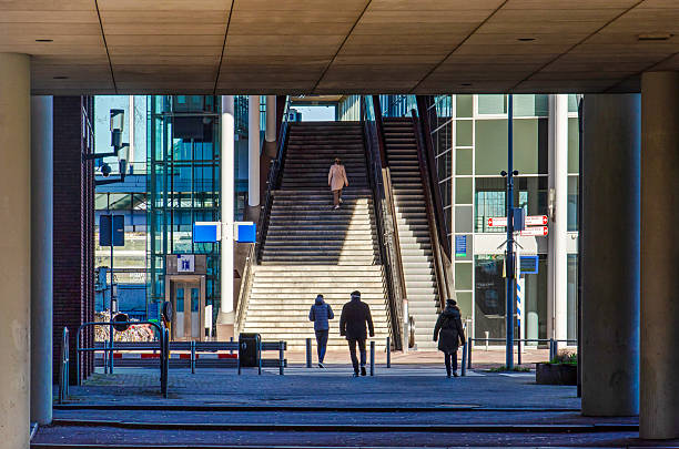 Maarssen, The Netherlands, March 16, 2025: view towards the stairway and escalator to the railway station