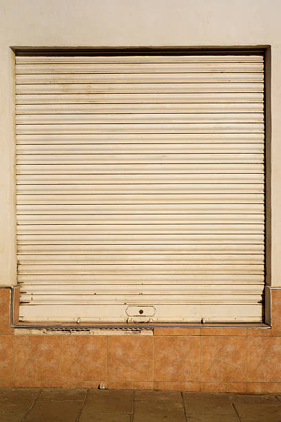 istock Closed blinds in a street window 2206188960