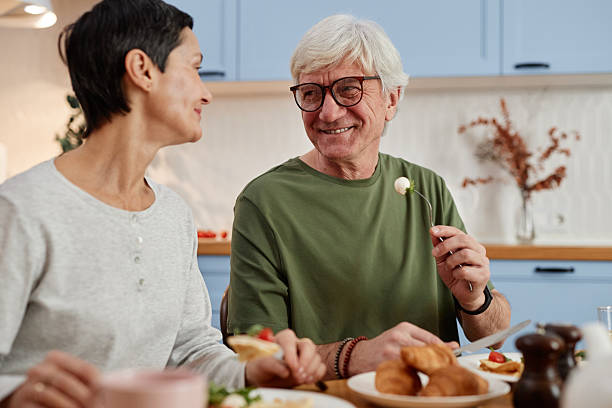istock Senior Couple Enjoying Breakfast Together at Home 2206189647