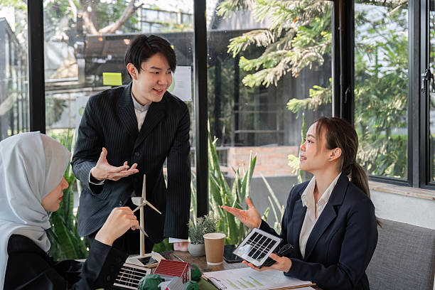 istock Climate Action and Team Collaboration. Professionals discussing solar energy solutions in a business setting. 2206190907