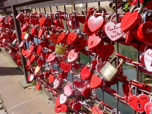 istock Heart-shaped love locks on a bridge railing. 2206191140