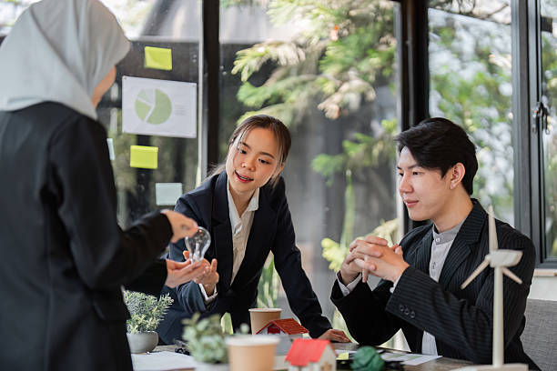 istock Collaborative Strategies for Sustainable Development. A team engaged in creative discussions about eco-initiatives. 2206191166