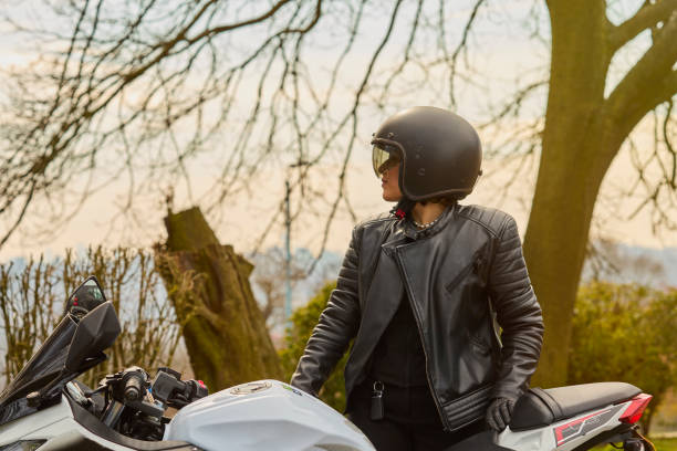 istock Young Woman Exploring the Countryside by Motorcycle 2206191432