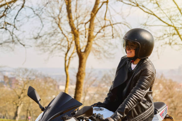 istock Young Woman Exploring the Countryside by Motorcycle 2206191532