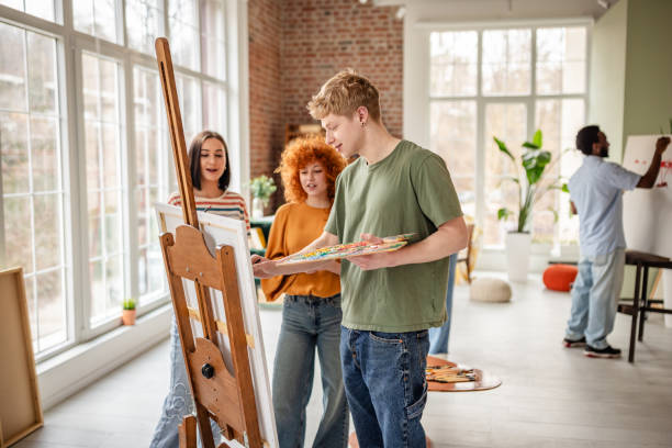 istock Young artists collaborate and share ideas in a vibrant art studio filled with inspiration and creativity 2206194183