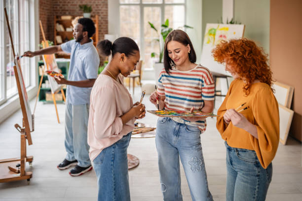 istock Young artists collaborate and create in a vibrant art studio fostering creativity and inspiration 2206194380