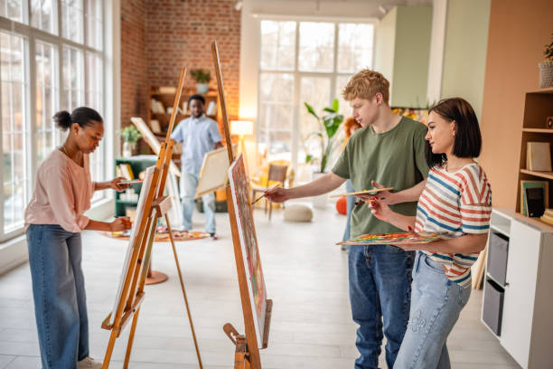 istock Young artists collaborate and create in a vibrant art studio filled with inspiration and creativity during a dynamic workshop 2206194528