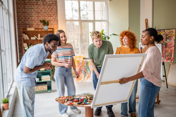 istock Young artists collaborate and share ideas in a vibrant art studio during an engaging workshop 2206194651