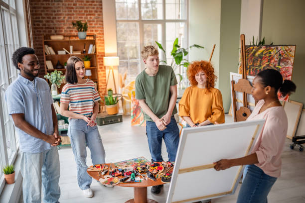 istock Young artists collaborate and inspire each other in an art studio filled with creativity and skill 2206194691