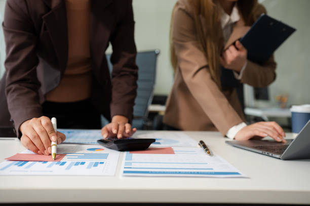 istock Businessmen team or financial data analysts working with tablets and laptop computers and data graphs together. Plan to analyzing projects in the office. 2206197313