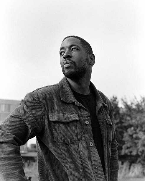 istock Pensive black man looking away in black and white portrait 2206198979
