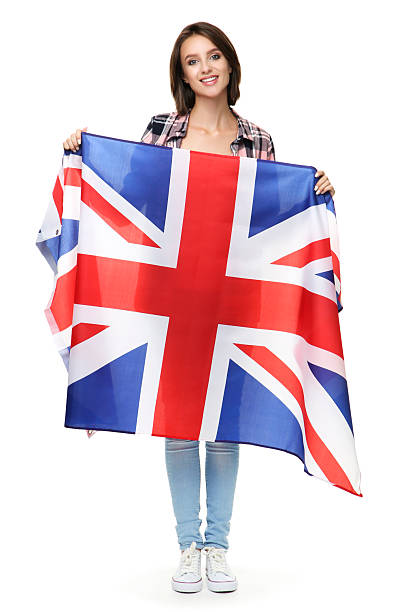 istock Beautiful young woman holding british flag on white background 2206203727