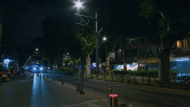 istock Light rail arriving at a station in Tel Aviv Jaffa at night 2206203828