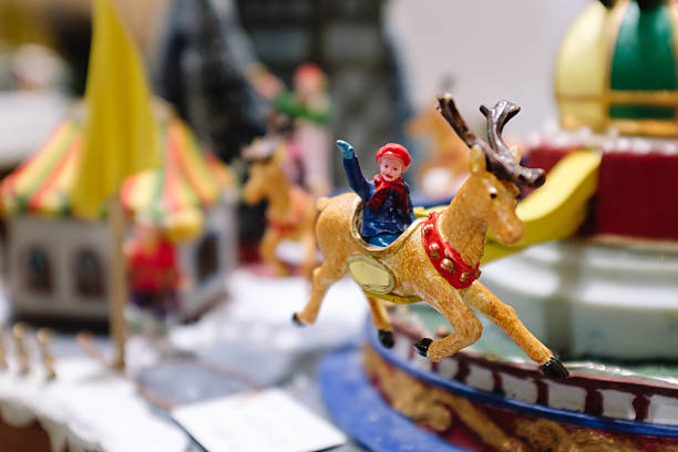 Miniature figurine riding a reindeer on a christmas carousel, bringing festive cheer