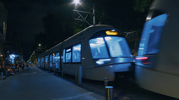 istock Modern tram passing by in Tel Aviv Jaffa at night 2206208178
