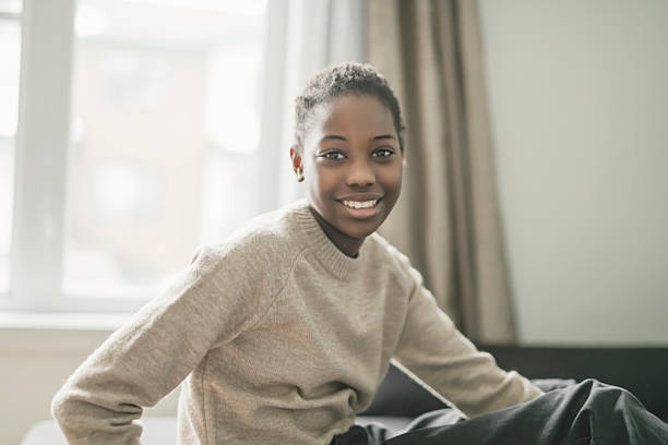 istock Relaxed american child on couch at home 2206209091