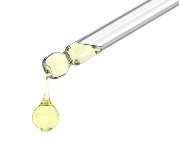 istock Dripping yellow serum from a pipette 2206210676