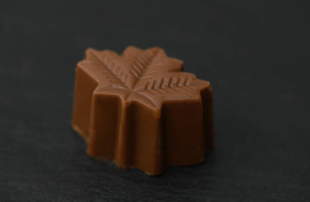 istock Delightful chocolate leaf confection resting on a dark slate background evokes autumn nostalgia and sweet indulgence 2206213585
