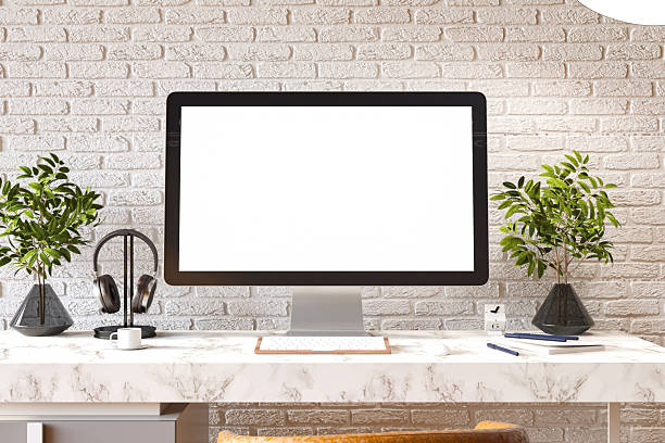 Modern Workspace with an Empty PC Monitor Screen and White Brick Wall. 3D Render