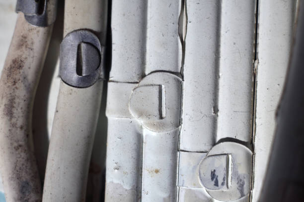 This close-up image showcases weathered plastic insulation with connectors. The intricate details reveal textures and shapes indicative of industrial environments, ideal for technology-related projects.