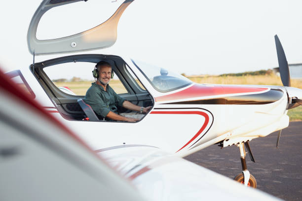 Airplane pilot sitting in a private jet and preparing it for a take-off