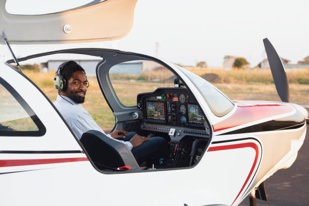 istock African American pilot  in the jet is preparing for departure 2206219103