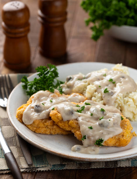 istock Fried chicken cutlets with mashed potatoes and gravy 2206220359
