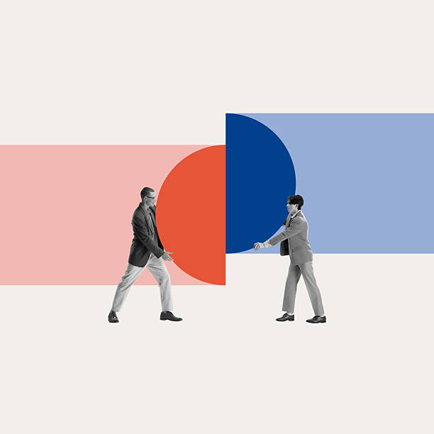 istock Business collaboration. Two businessmen connecting pieces, symbolizing merger of ideas, teamwork, negotiation strategies. 2206224227