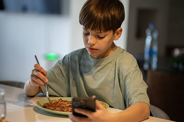 istock Happy Boy Enjoying Spaghetti Meal 2206224370