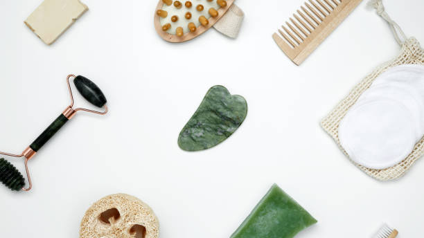 istock Embodying a sustainable self-care concept, eco-friendly beauty essentials, including soap, bamboo toothbrush, loofah sponge, marble face roller 2206224573