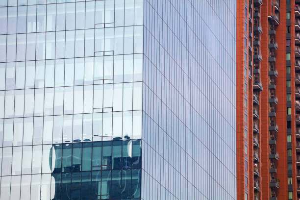 Corner of office building with reflection on facade  in Bangkok downtown