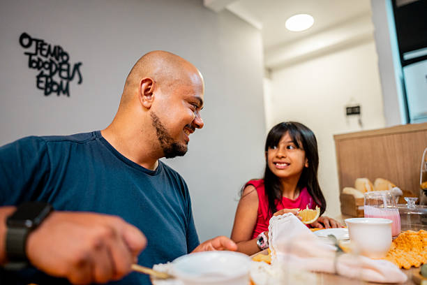 istock Father and daughter having breakfast at home 2206228829