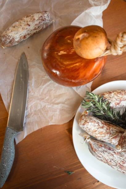 A rustic display of Italian artisan cheeses, handcrafted with traditional methods. Featuring diverse textures, colors, and flavors, it highlights Italy’s rich cheesemaking heritage—ideal for gourmet food and authentic cuisine themes.