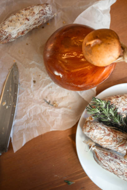 A rustic display of Italian artisan cheeses, handcrafted with traditional methods. Featuring diverse textures, colors, and flavors, it highlights Italy’s rich cheesemaking heritage—ideal for gourmet food and authentic cuisine themes.