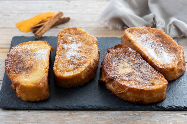 istock Traditional Spanish torrijas for Holy Week on wooden tableq 2206237372