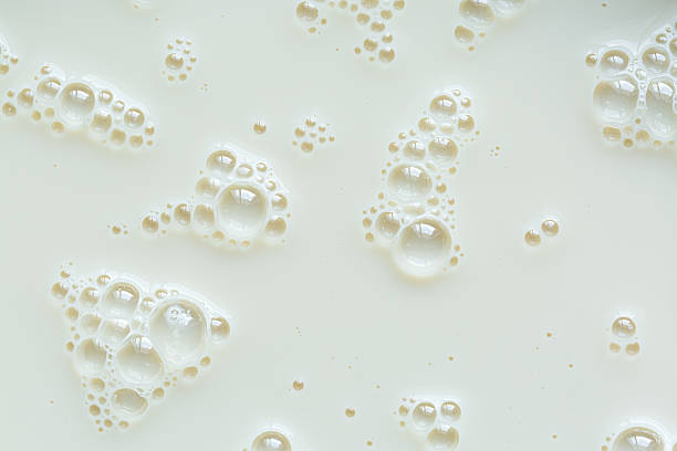 istock Macro milk texture,macro milk background,White surface of milk and bubbles and ripples from above birds eye view 2206239557