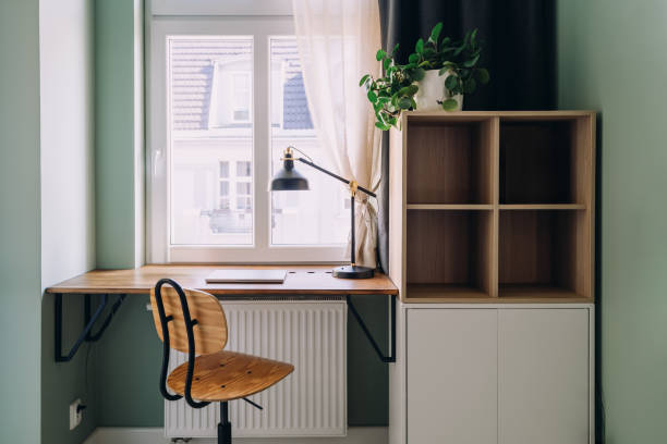 istock Home office with desk against window in small apartment 2206241787