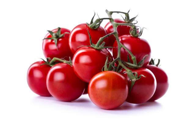 istock Freshly harvested cherry tomatoes displayed on a bright background highlighting their vibrant red color and green vine 2206242661