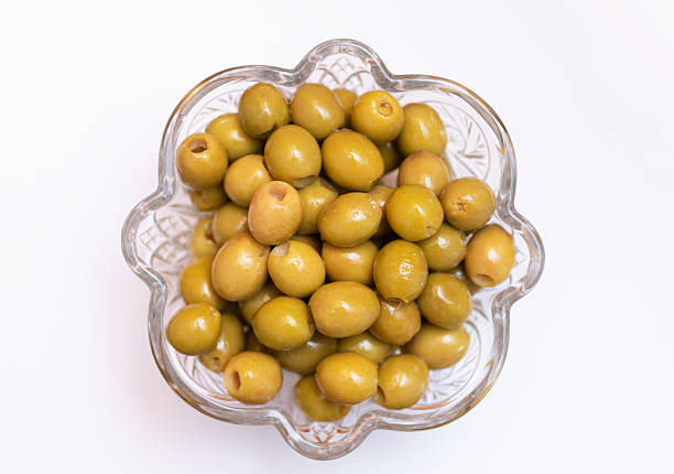 Delicious grilled green olives isolated on white