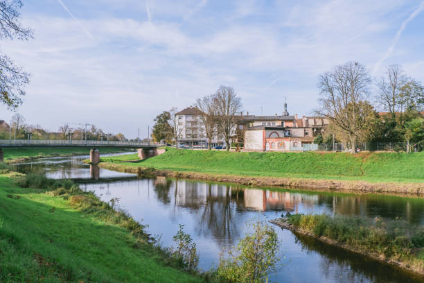 istock River runs through a town with a bridge over it 2206246223