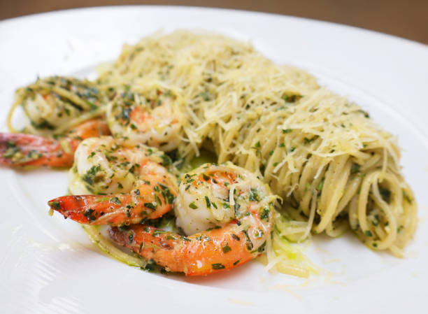 Closeup of Mouthwatering Spaghetti with Shrimp and Pesto